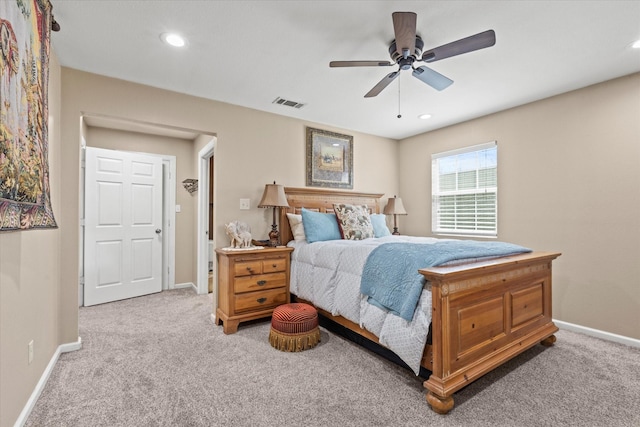 carpeted bedroom featuring recessed lighting, visible vents, baseboards, and a ceiling fan