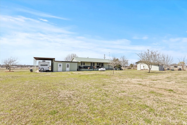 view of yard with an attached carport