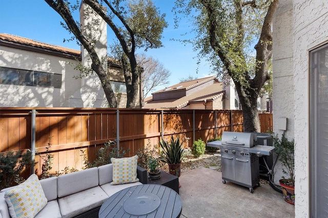 view of patio / terrace featuring an outdoor living space, a fenced backyard, and grilling area