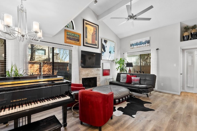 living area with plenty of natural light, a fireplace, and wood finished floors