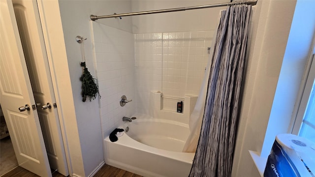 bathroom with shower / bathtub combination with curtain