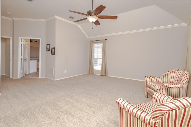 sitting room with visible vents, light colored carpet, ornamental molding, and vaulted ceiling