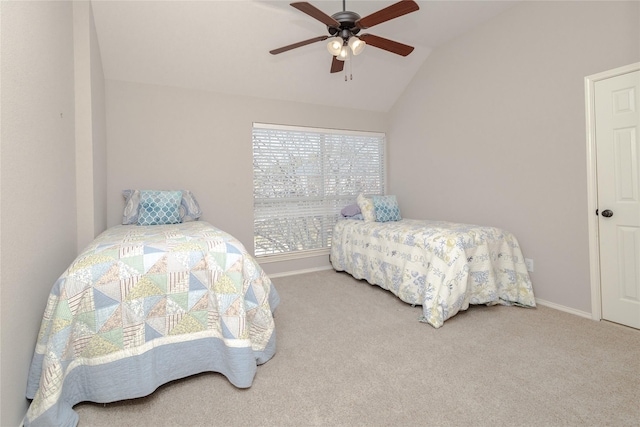 bedroom with a ceiling fan, vaulted ceiling, carpet, and baseboards