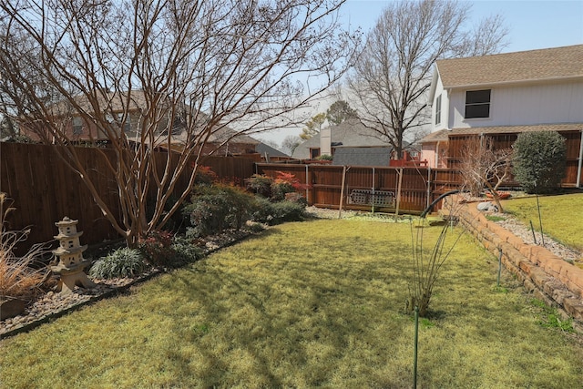 view of yard with a deck and fence