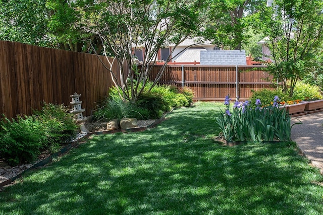 view of yard featuring fence