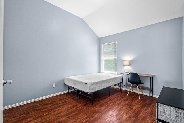 bedroom featuring vaulted ceiling, wood finished floors, and baseboards