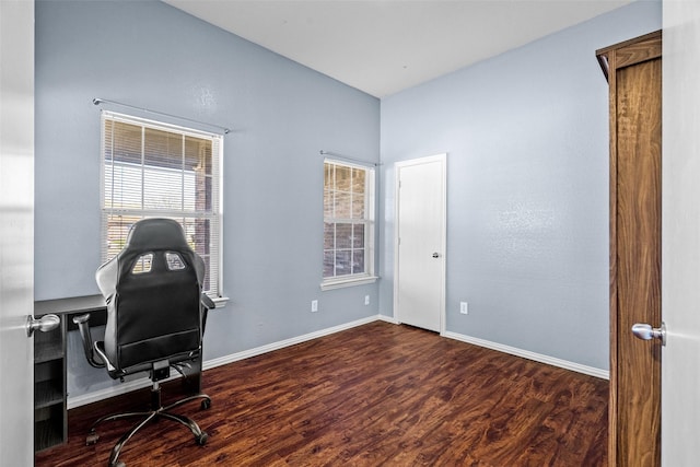 office space featuring baseboards, plenty of natural light, and wood finished floors