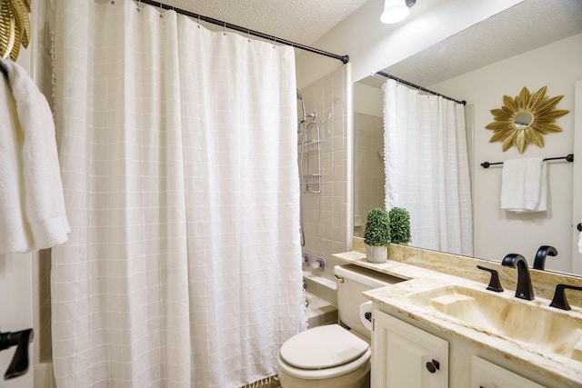 full bath featuring vanity, a textured ceiling, shower / tub combo with curtain, and toilet