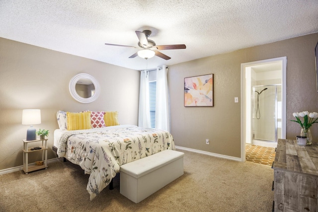 bedroom with baseboards, ceiling fan, carpet flooring, ensuite bathroom, and a textured ceiling