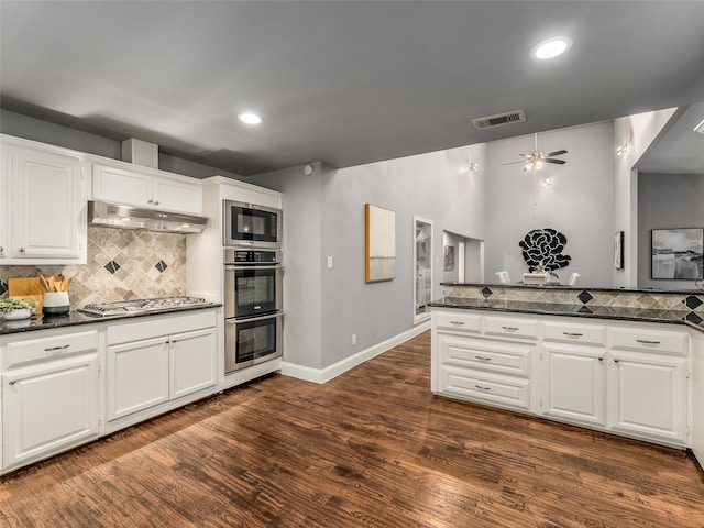 kitchen featuring visible vents, a ceiling fan, under cabinet range hood, stainless steel appliances, and white cabinets