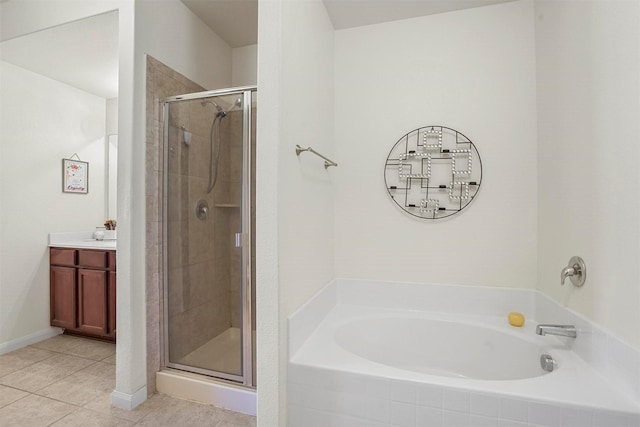 full bath with a bath, tile patterned flooring, a stall shower, and vanity