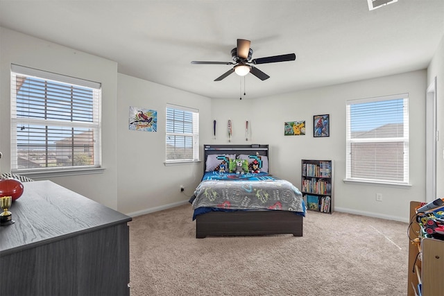 bedroom featuring baseboards, carpet, and a ceiling fan