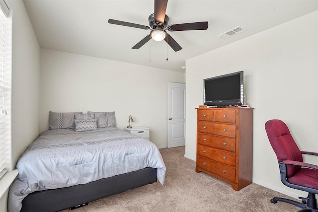 bedroom with visible vents, carpet flooring, baseboards, and ceiling fan