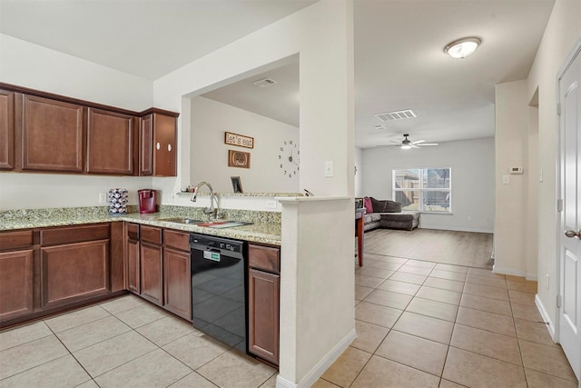 kitchen featuring visible vents, a ceiling fan, a sink, black dishwasher, and light tile patterned flooring