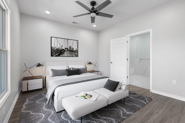 bedroom with recessed lighting, wood finished floors, visible vents, and baseboards