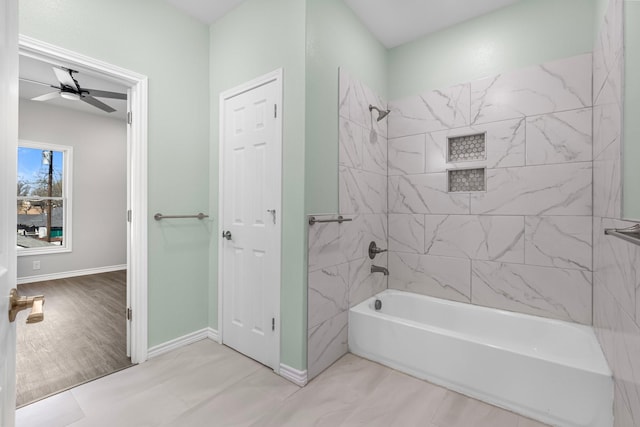 full bathroom featuring wood finished floors, baseboards, shower / bathtub combination, and ceiling fan