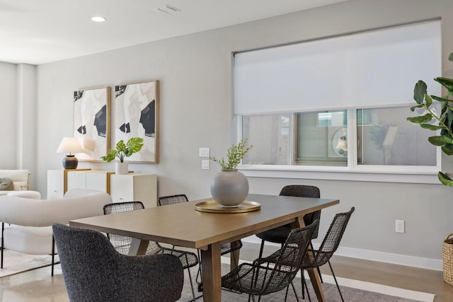 dining area with recessed lighting and baseboards