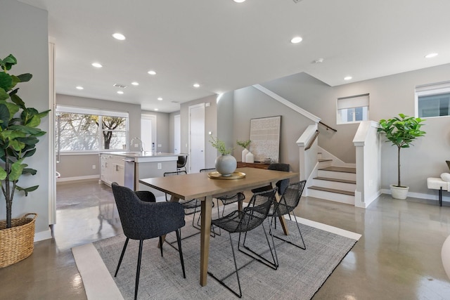 dining space with recessed lighting, stairs, and baseboards