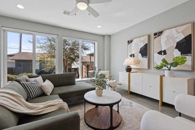 living room with a ceiling fan, recessed lighting, finished concrete flooring, and visible vents