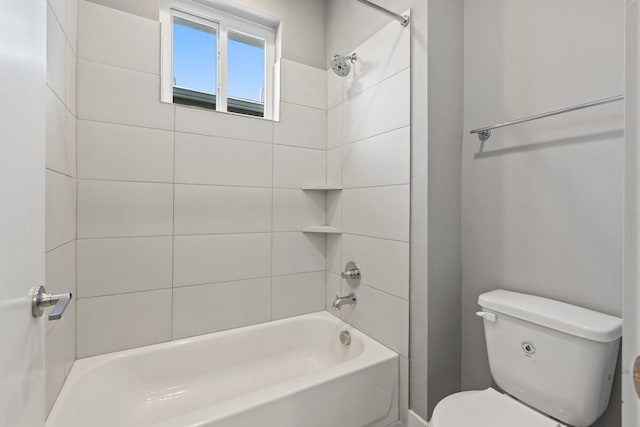 bathroom featuring toilet and shower / tub combination