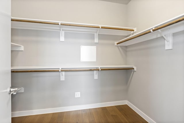 spacious closet with wood finished floors