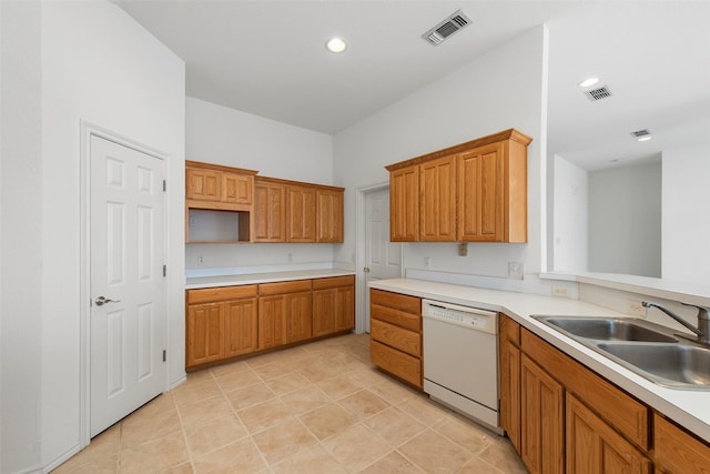 kitchen with visible vents, white dishwasher, a sink, light countertops, and brown cabinets