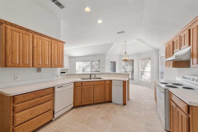 kitchen with visible vents, under cabinet range hood, a sink, white appliances, and a peninsula