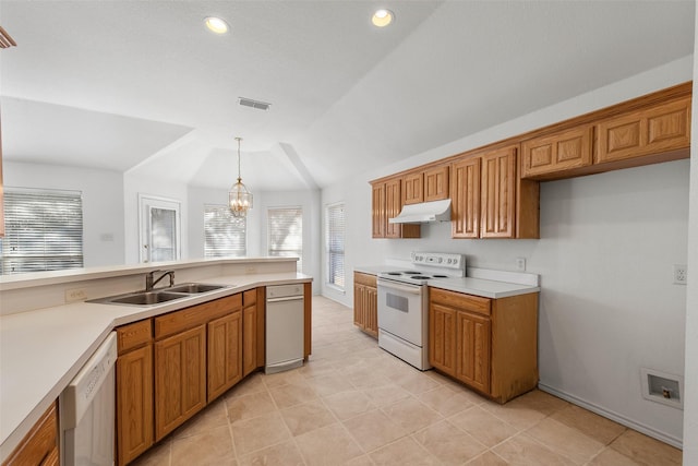 kitchen featuring white appliances, visible vents, a sink, under cabinet range hood, and brown cabinets