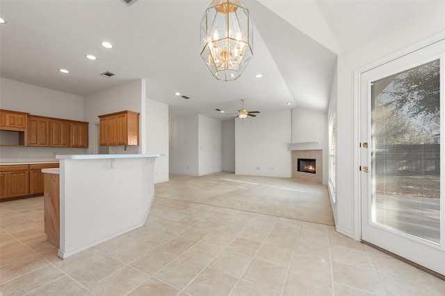 kitchen with plenty of natural light, light colored carpet, light countertops, and visible vents