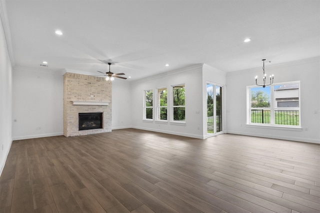 unfurnished living room with recessed lighting, baseboards, dark wood-type flooring, and ceiling fan with notable chandelier