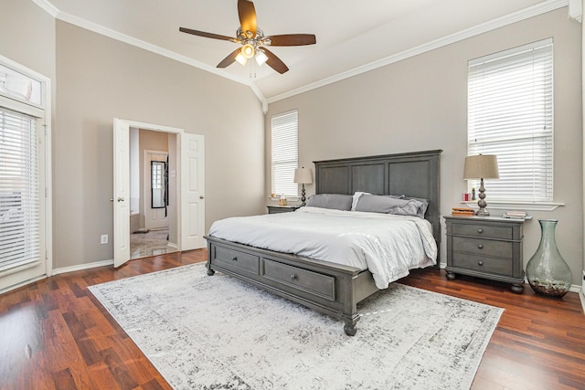 bedroom with baseboards, wood finished floors, crown molding, and vaulted ceiling