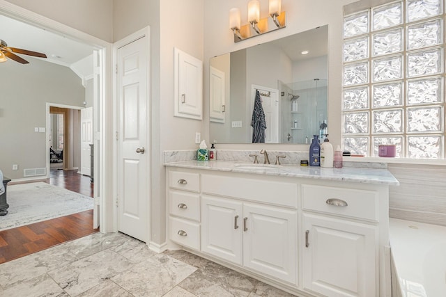 full bath featuring an enclosed shower, vanity, lofted ceiling, and a ceiling fan