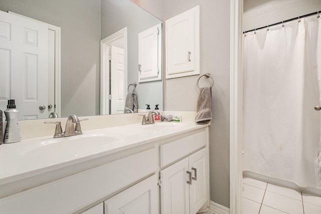 full bath featuring tile patterned floors, shower / bath combination with curtain, double vanity, and a sink