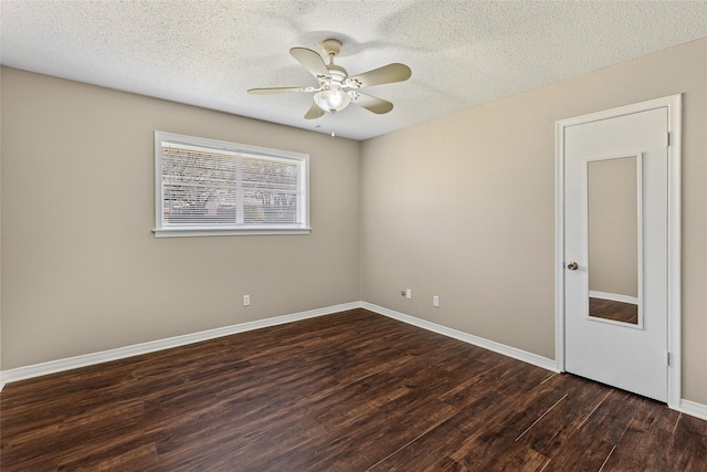 6305 Chapman Dr, Greenville, TX 75402 - empty room with a ceiling fan, wood finished floors, a textured ceiling, and baseboards