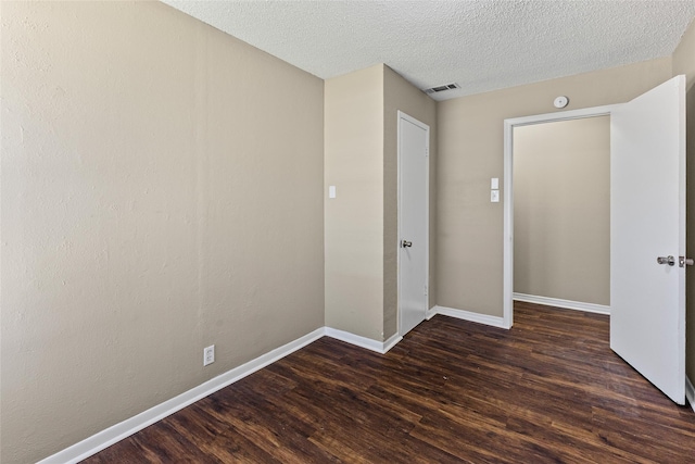 6305 Chapman Dr, Greenville, TX 75402 - unfurnished room with wood finished floors, baseboards, and a textured ceiling