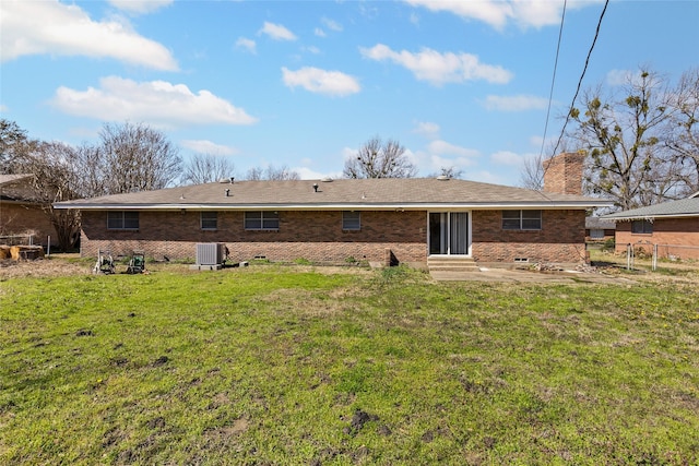 6305 Chapman Dr, Greenville, TX 75402 - rear view of property featuring central AC unit, entry steps, a chimney, a patio, and brick siding