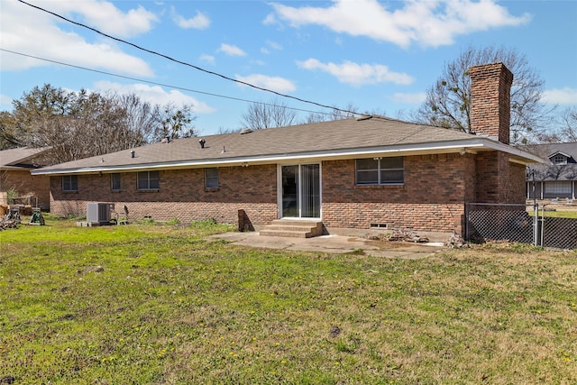 6305 Chapman Dr, Greenville, TX 75402 - back of property with a chimney, central air condition unit, brick siding, a patio area, and entry steps