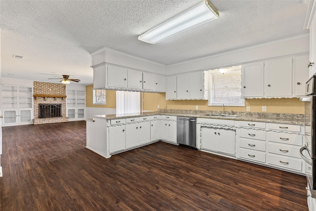 6305 Chapman Dr, Greenville, TX 75402 - kitchen featuring dishwasher, a ceiling fan, a textured ceiling, a sink, and a peninsula