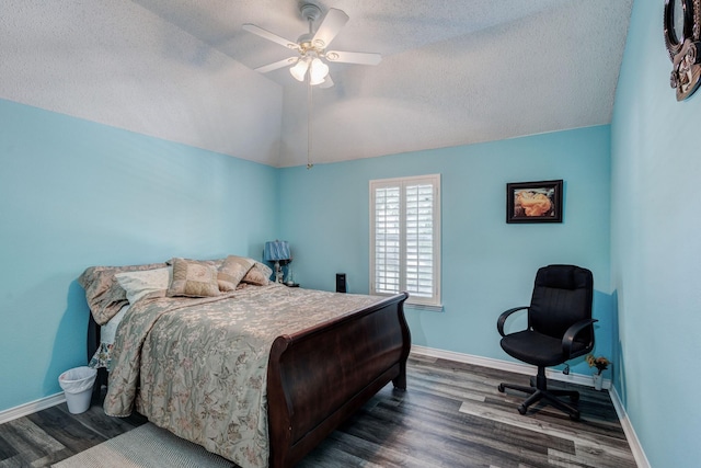 bedroom with baseboards, wood finished floors, and vaulted ceiling