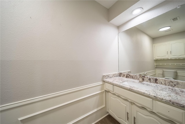 bathroom featuring vanity and visible vents