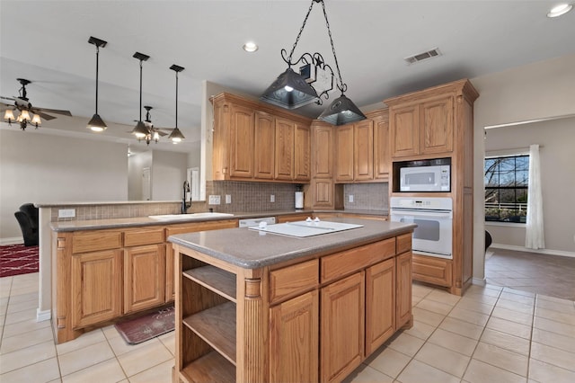 kitchen featuring a ceiling fan, open shelves, a sink, white appliances, and light tile patterned floors