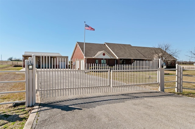 view of gate featuring a fenced front yard