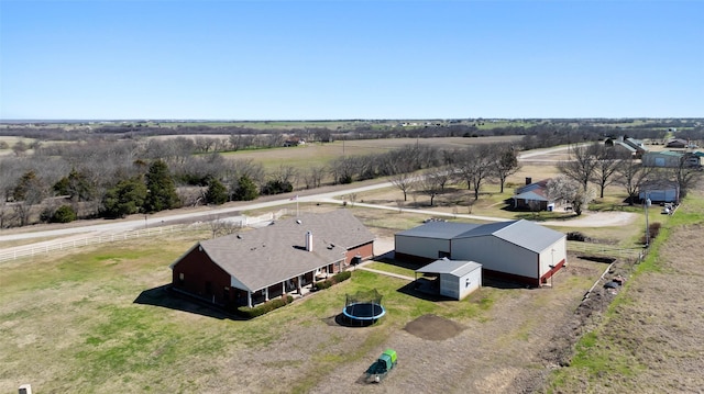 birds eye view of property featuring a rural view