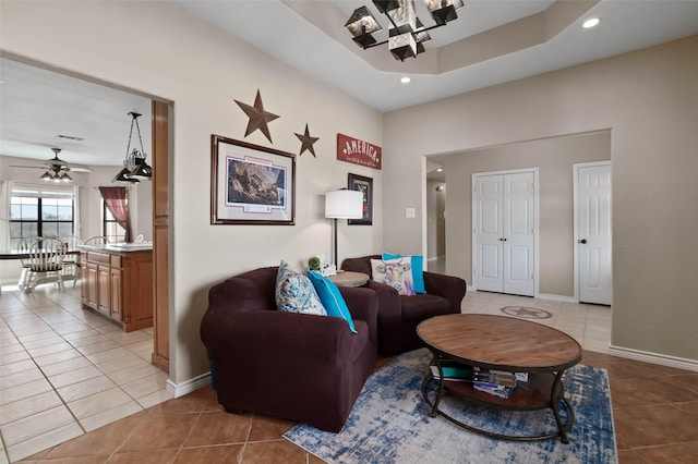 living area with light tile patterned floors, baseboards, and recessed lighting