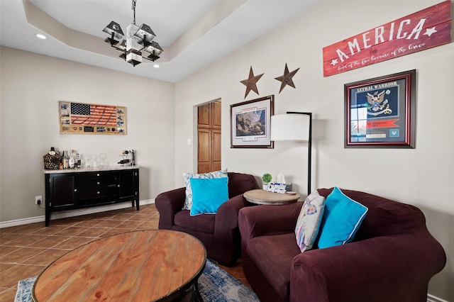 living room featuring tile patterned flooring, baseboards, a dry bar, a tray ceiling, and recessed lighting