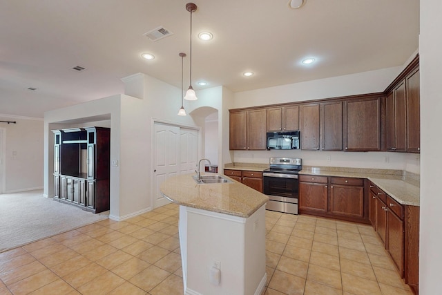 kitchen with visible vents, stainless steel range with electric stovetop, a sink, arched walkways, and black microwave