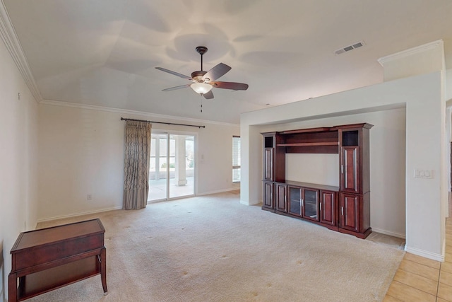 living area with crown molding, baseboards, visible vents, and ceiling fan