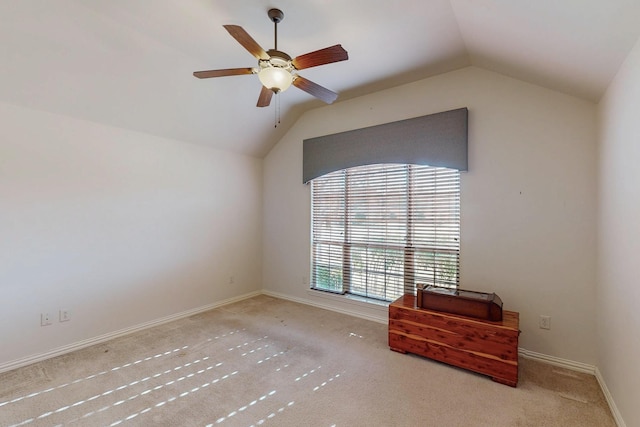 bedroom featuring baseboards, lofted ceiling, carpet, and a ceiling fan