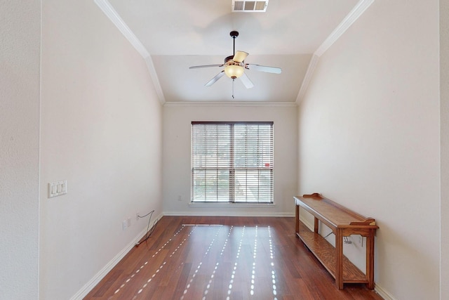 unfurnished room featuring visible vents, ornamental molding, ceiling fan, and wood finished floors