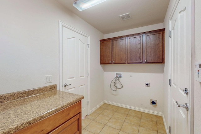 washroom featuring visible vents, gas dryer hookup, washer hookup, cabinet space, and hookup for an electric dryer